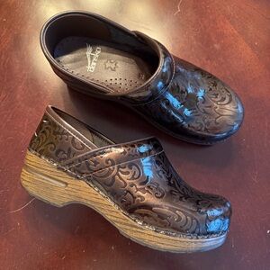 Dansko Dark Brown Embossed Clogs